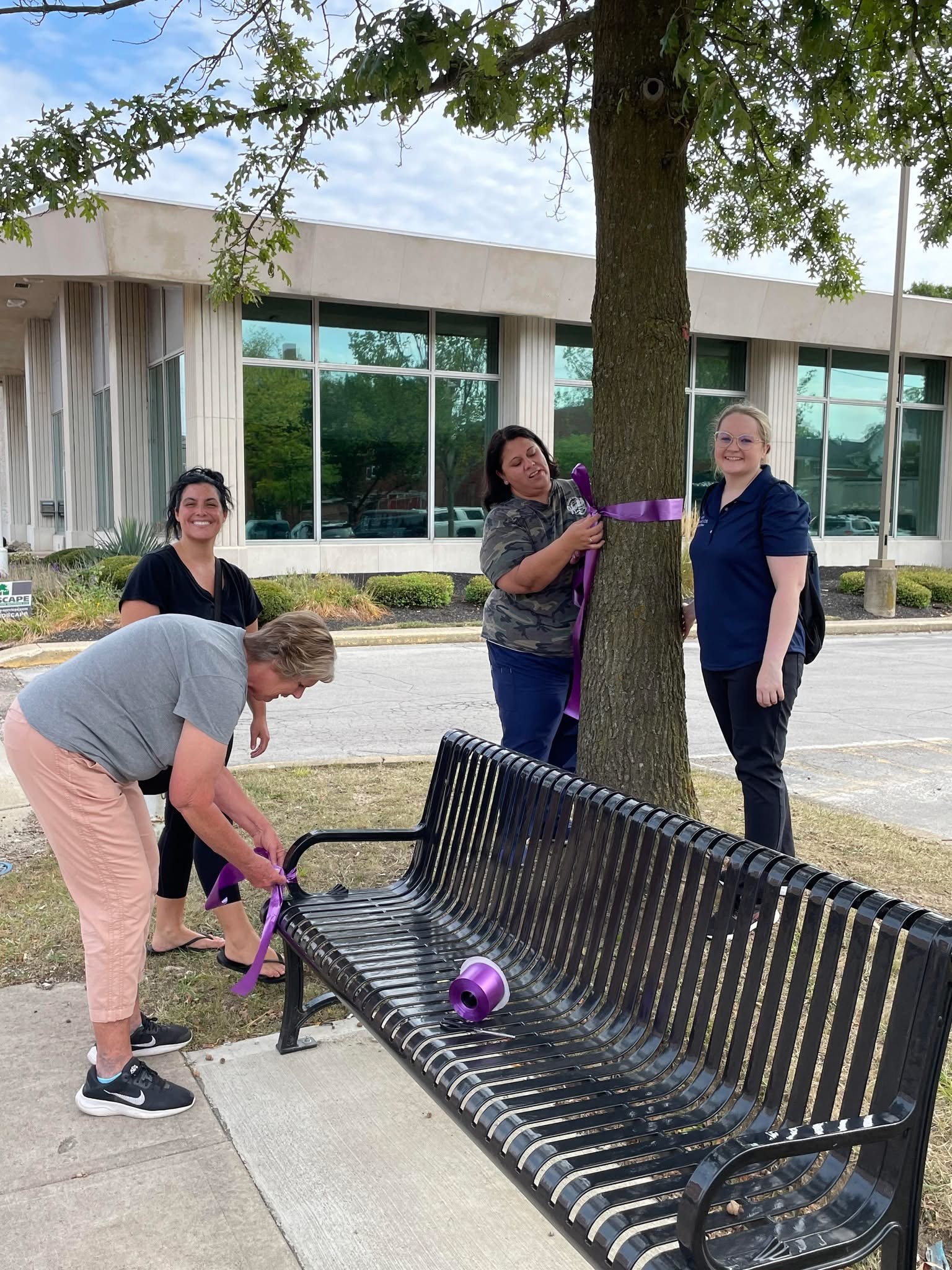 Morrow County community partners tying purple ribbons for Overdose Awareness Day.