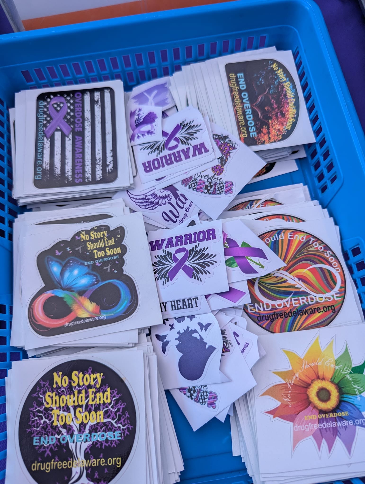 Overdose awareness stickers featuring purple ribbons and messages of hope.